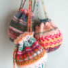 靴下編みで余ったOpal毛糸の消費に、またまたミニ巾着を編んでいます